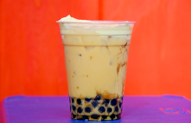 Mango Milk Tea with brown sugar tapioca spheres topped with pineapple cold foam available at Lucky Fortune Cookery in San Fransokyo Square during Disney California Adventure's Lunar New Year celebration in Anaheim, CA, on Friday, January 23, 2026. They are celebrating The Year of the Horse January 23 through February 22, 2026. (Photo by Jeff Gritchen, Orange County Register/SCNG)