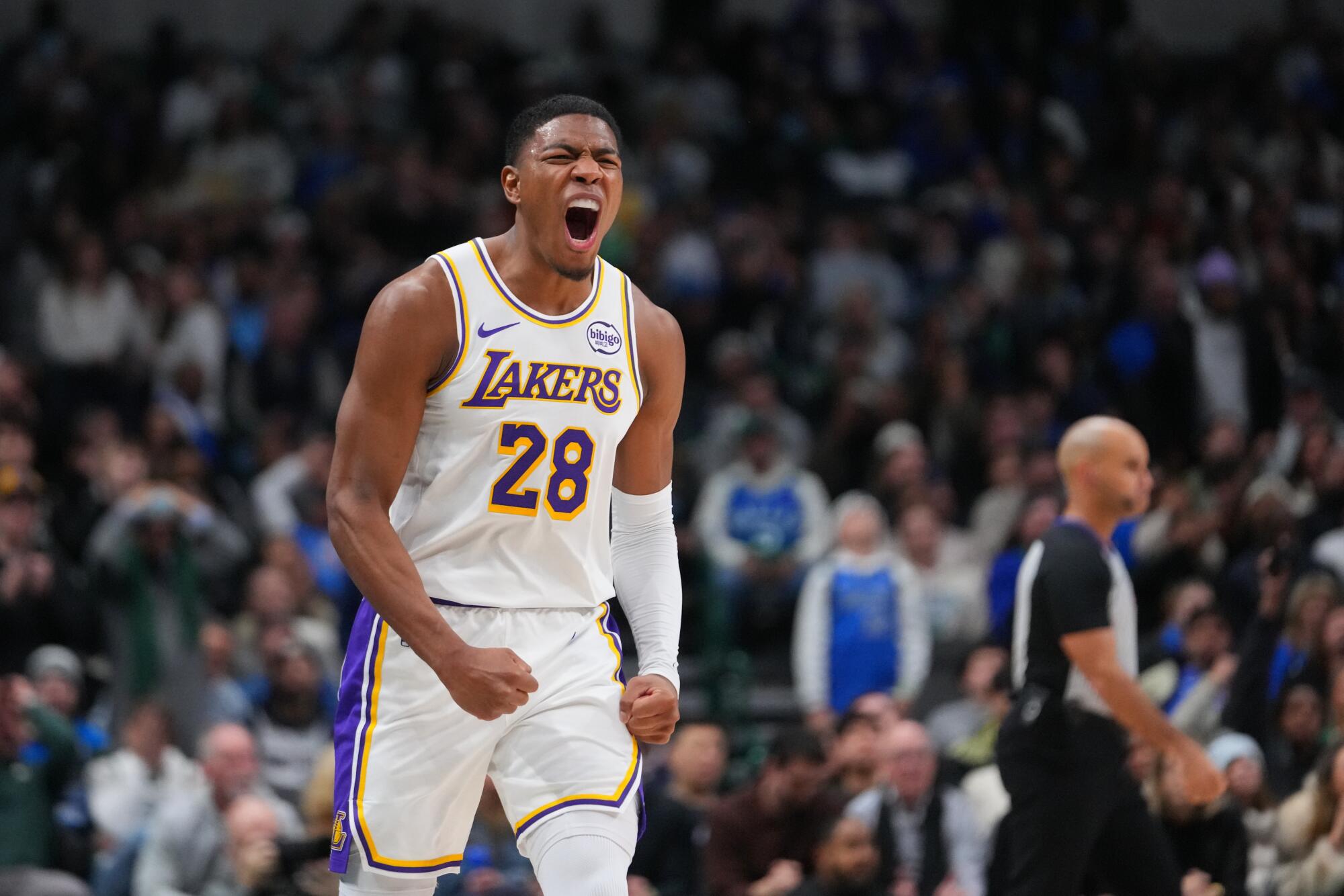 Lakers forward Rui Hachimura celebrates after scoring against the Mavericks in the second quarter Saturday.