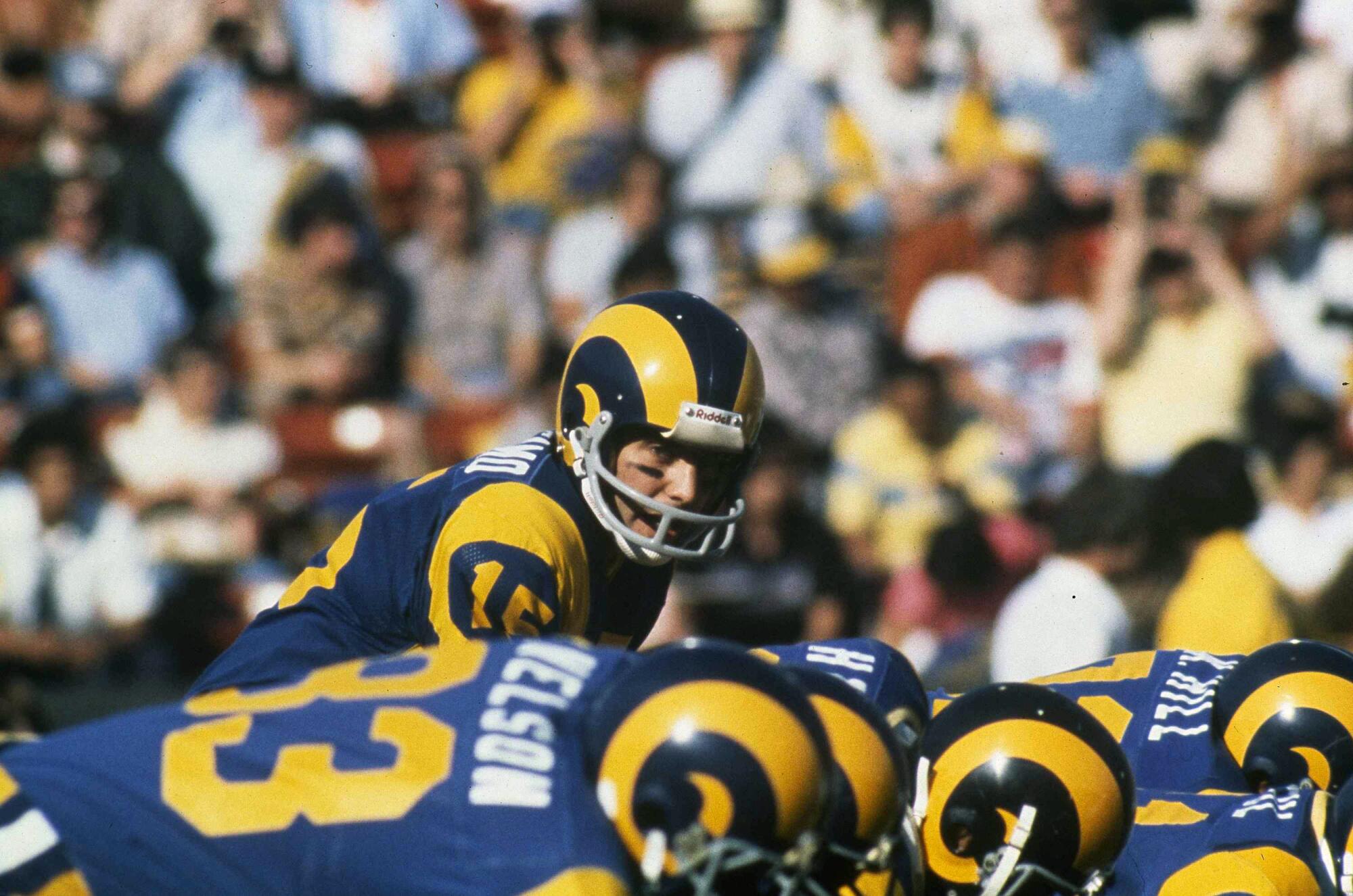 Rams quarterback Vince Ferragamo prepares to take a snap during a game in 1980.