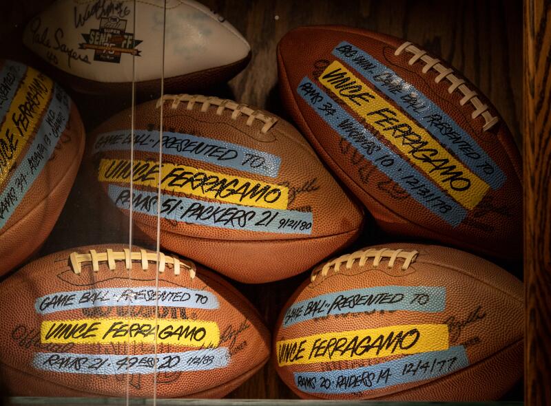 A view of footballs that are among Vince Ferragamo's memorabilia in his home.