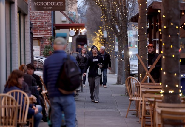 People walk along Shattuck Avenue near Hearst Street looking north towards Rose Street in Berkeley, Calif., on Wednesday, Jan. 21, 2026. Berkeley is considering up-zoning three commercial zones to encourage more housing development. (Jane Tyska/Bay Area News Group)