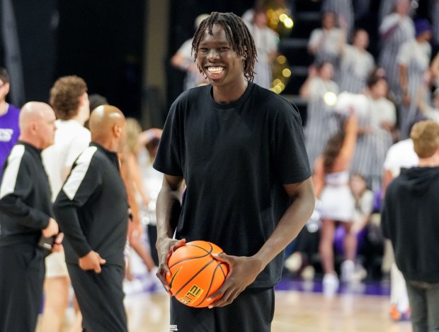 Out with a hip injury, SDSU's Magoon Gwath smiles before the Jan. 21 game against Grand Canyon at GCU Arena in Phoenix. (Darryl Webb, for The San Diego Union-Tribune)