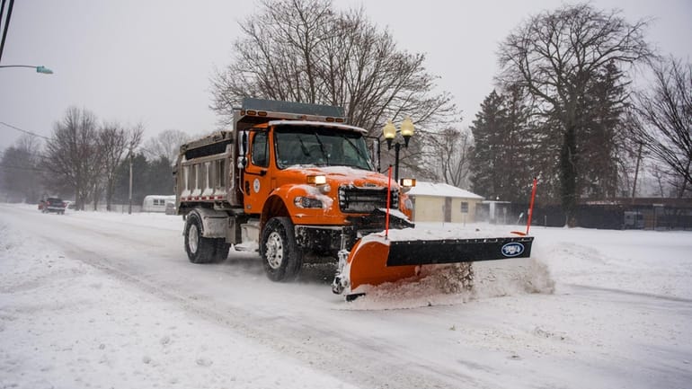A slow plow on Church Street in Bohemia on Sunday. 