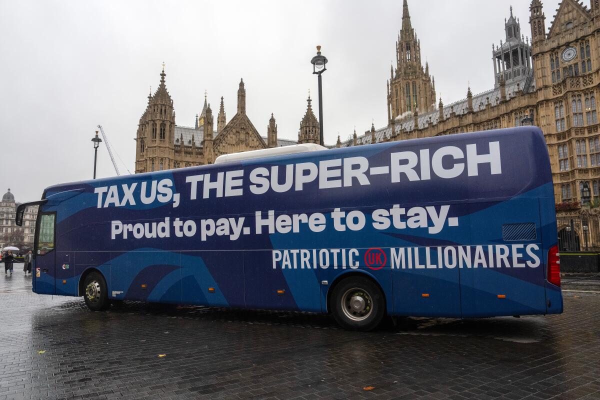 A bus in London promotes a campaign by British millionaires advocating for an end to extreme wealth and inequality.