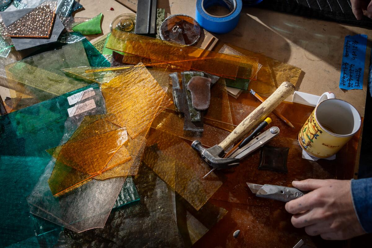 Pieces of glass and hammer used for an art project.