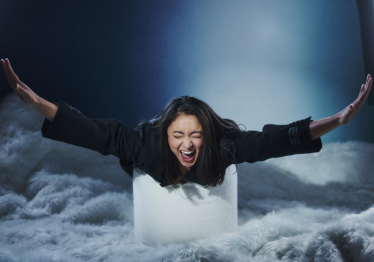 A woman poses for a photo