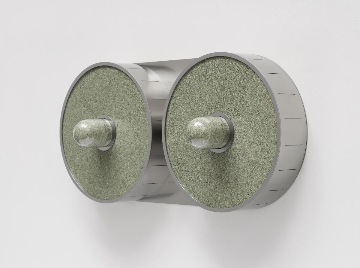 A sculpture featuring two round discs