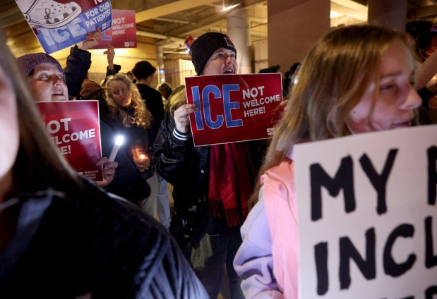 Registered nurse Michelle Trautman, center, and others attend a protest outside of UCSF Benioff Children's Hospital Oakland in Oakland, Calif., on Monday, Jan. 26, 2026. Protesters are demanding justice and the abolishment of U.S. Immigration and Customs Enforcement (ICE ) in the wake of the killing of Veteran's Administration nurse Alex Pretti in Minneapolis. (Jane Tyska/Bay Area News Group)l