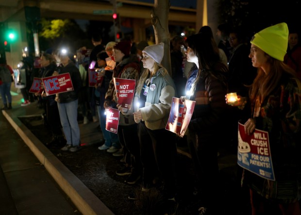 Healthcare professionals and community members attend a protest outside of UCSF Benioff Children's Hospital Oakland in Oakland, Calif., on Monday, Jan. 26, 2026. Healthcare professionals and others are demanding justice and the abolishment of U.S. Immigration and Customs Enforcement (ICE ) in the wake of the killing of Veteran's Administration nurse Alex Pretti in Minneapolis. (Jane Tyska/Bay Area News Group)l