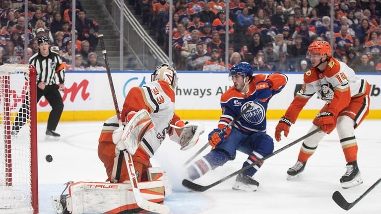 Anaheim Ducks' goalie Ville Husso (33) is scored on as...