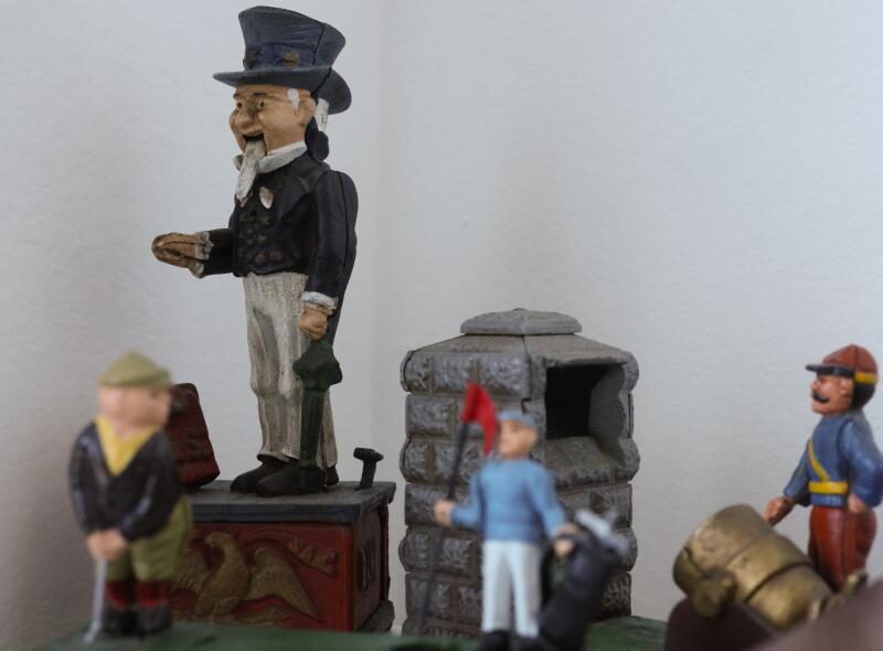 Wooden figurines depict men