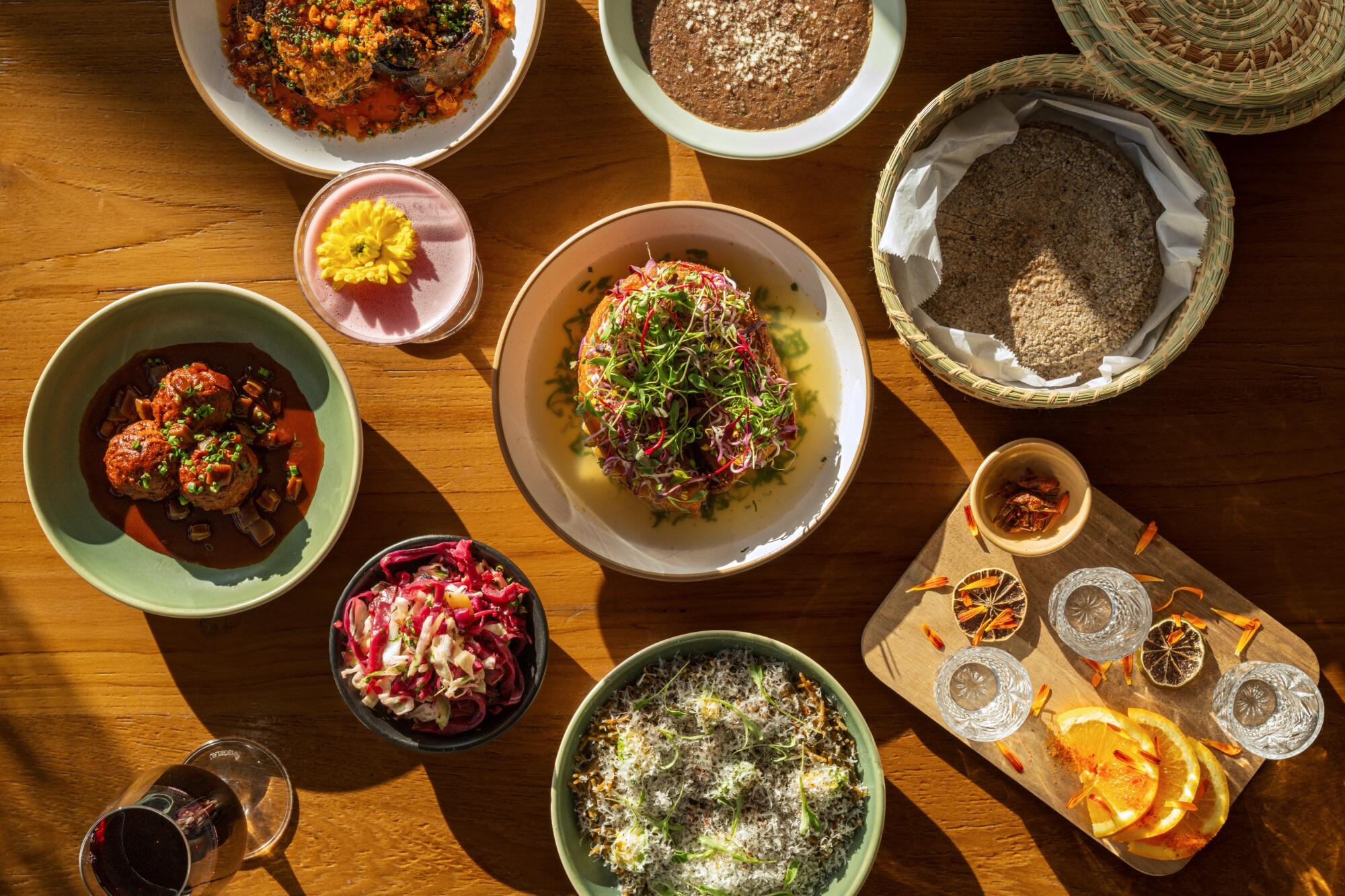 Sweet potato, refried lentils, chicharron, fideo verde and albondigas with cocktails at Broken Spanish Comedor.