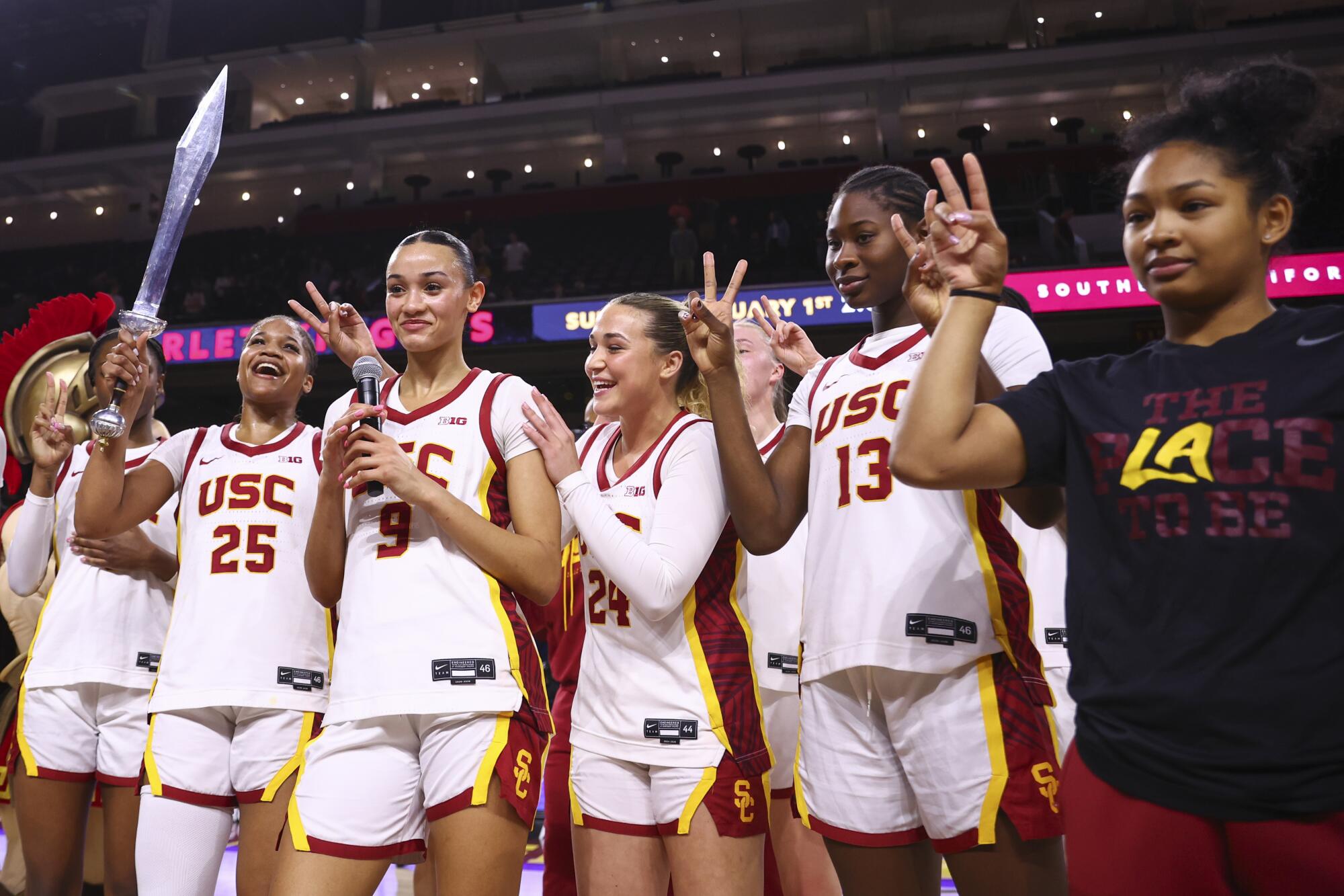 USC players (from left) Kara Dunn, Jazzy Davidson, Brooklyn Shamblin, Dayana Mendes and Malia Samuels celebrate.