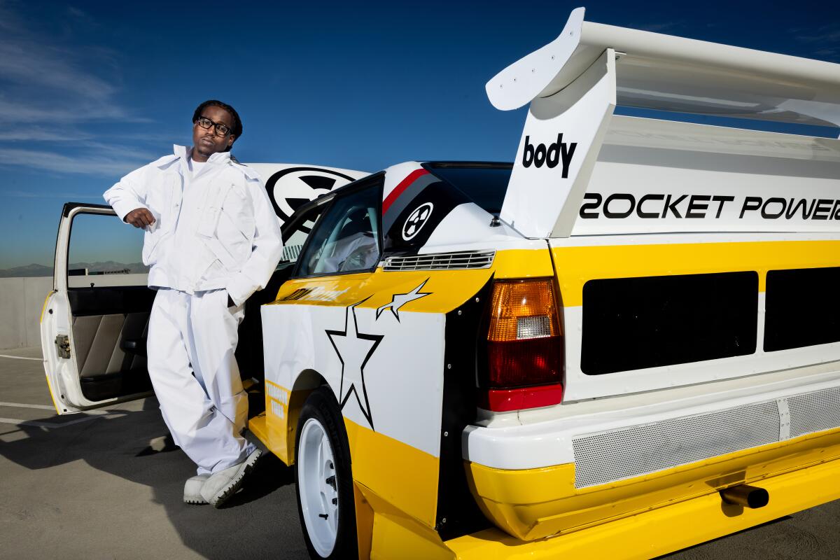 Rapper Don Toliver poses with his car.