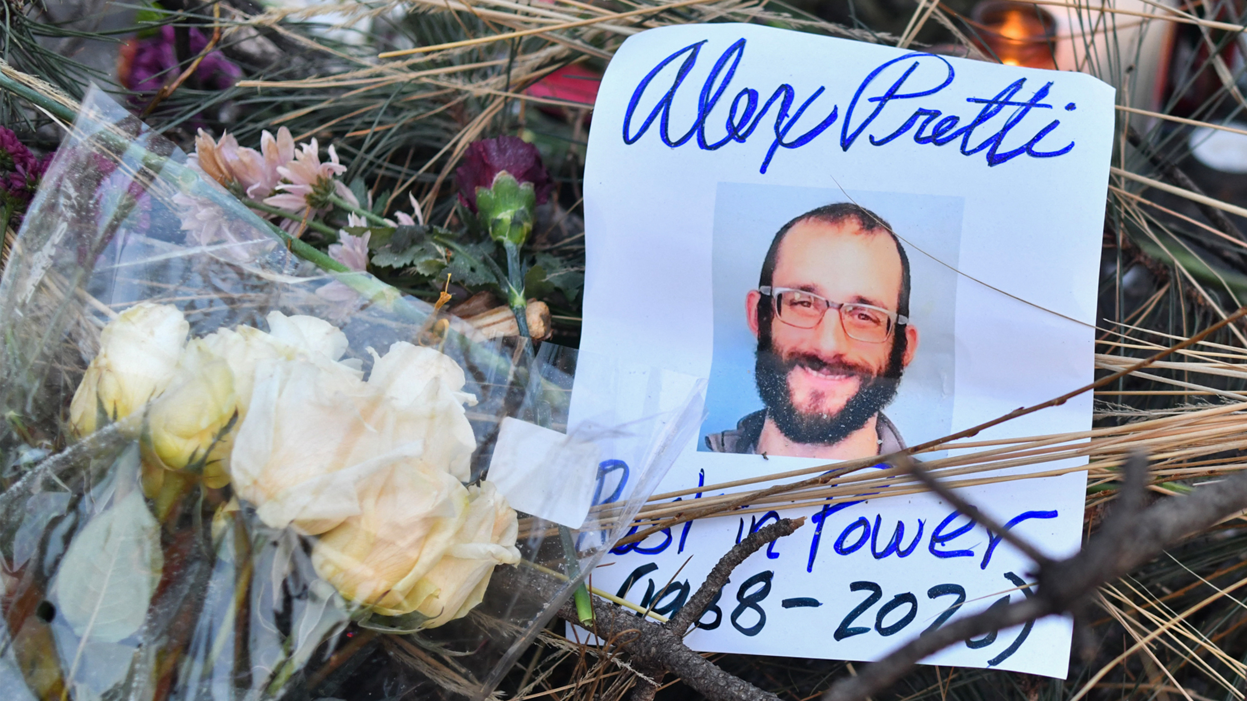 Flowers are left at a makeshift memorial in the area where Alex Pretti was shot dead a day earlier by federal immigration agents in Minneapolis, Minnesota, on January 25, 2026.