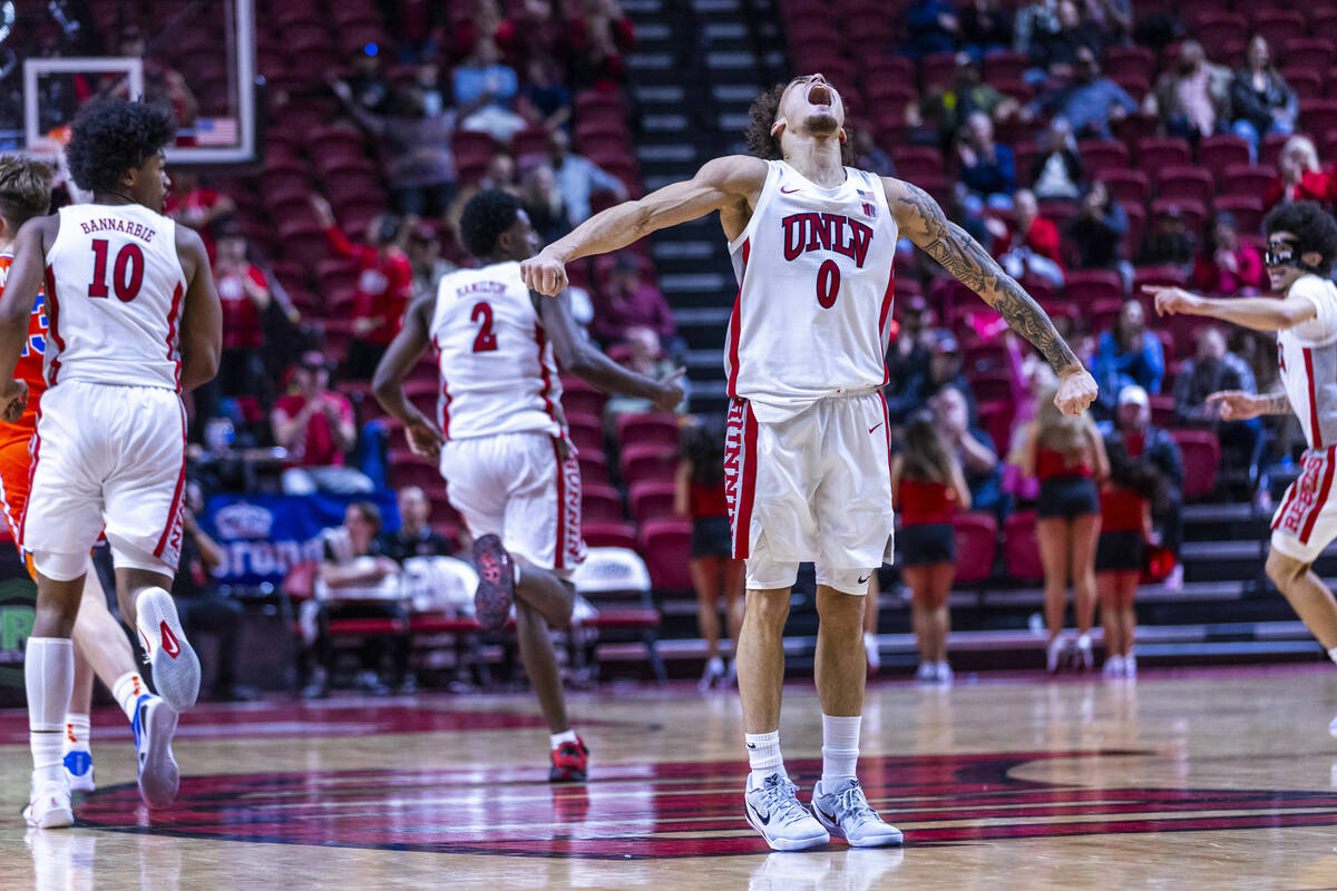 UNLV guard Dra Gibbs-Lawhorn (0) is pumped up as he hits a three-point basket and adds to their ...