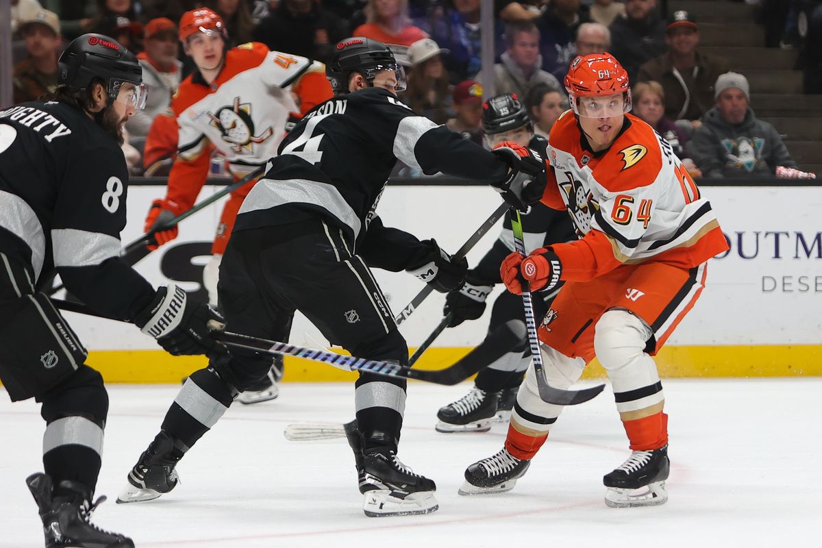 Los Angeles Kings defenseman Mikey Anderson (44) battles for position with Anaheim Ducks center Mikael Grandlund (64) during an NHL game on January 17, 2026 in Anaheim, CA.