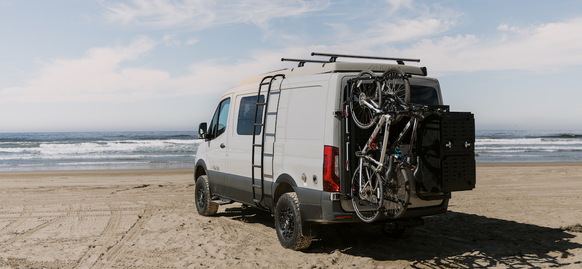 a customized sprinter van on the beach