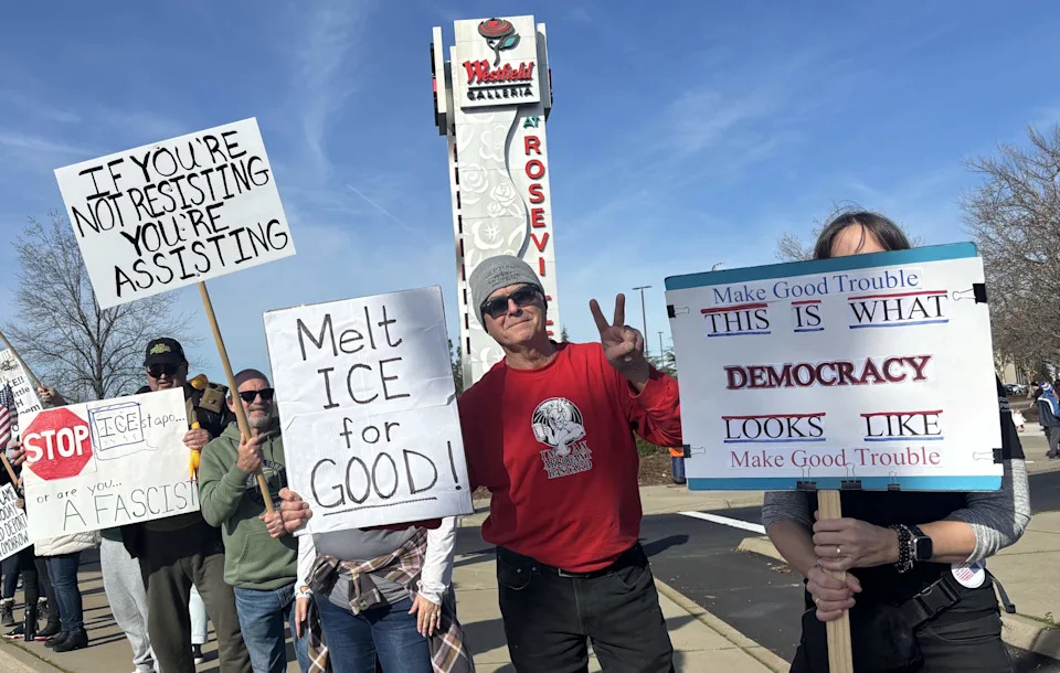 Protesters outside the Westfield Galleria mall in Roseville hold signs protesting U.S. Immigration and Customs Enforcement on Saturday, Jan. 10, 2026, after an ICE agent fatally shot a woman earlier in the week in Minneapolis.