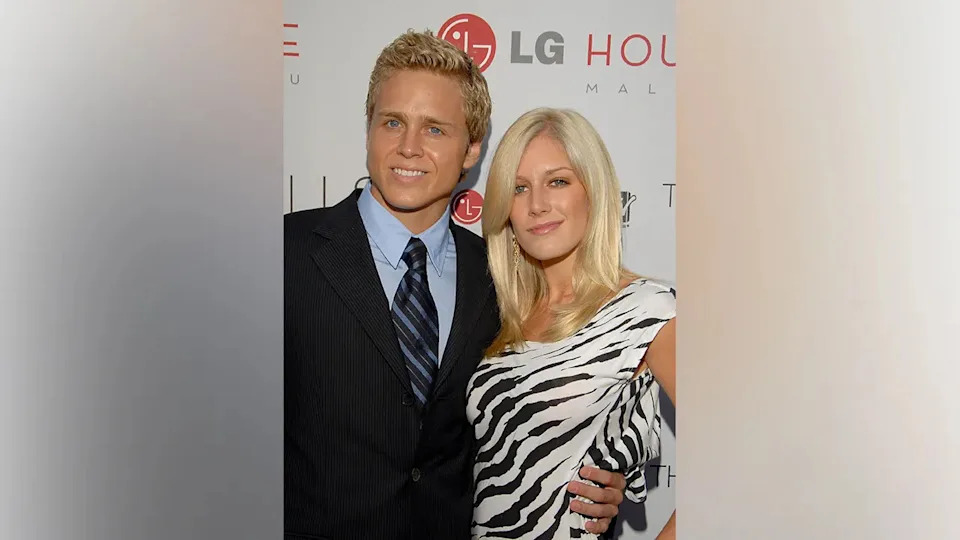 Spencer Pratt and Heidi Montag posing together on a red carpet.