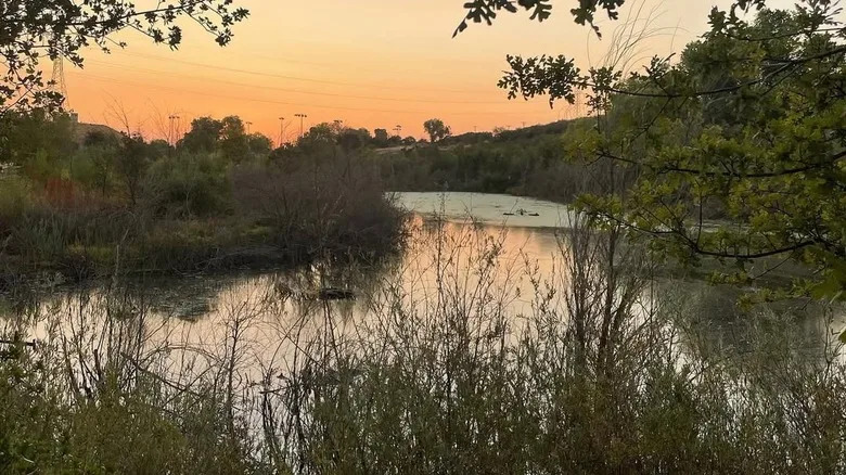 Sun sets over pond at Granite Regional Park