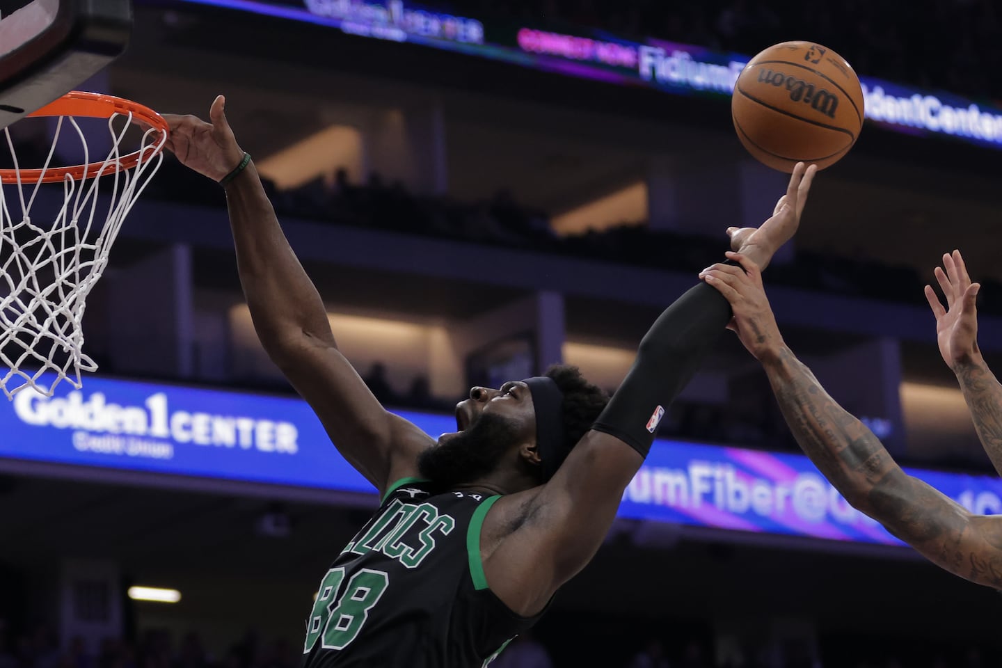 Boston Celtics center Neemias Queta is fouled by Sacramento Kings guard Demar Derozan during the first half.