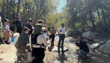 Image shows Dr. Adnan Rajib, lower right, in a creek  explaining water research to students " style=" height:1080px; width:1620px" _languageinserted="true" src="https://cdn.prod.web.uta.edu/-/media/80fcfbd2d29146ac87adc4601a95ba8f.jpg