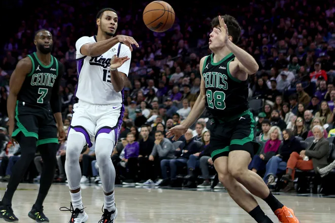Jan 1, 2026; Sacramento, California, USA; Sacramento Kings forward Keegan Murray (13) passes the ball against the Boston Celtics during the third quarter at Golden 1 Center. Mandatory Credit: Dennis Lee-Imagn Images