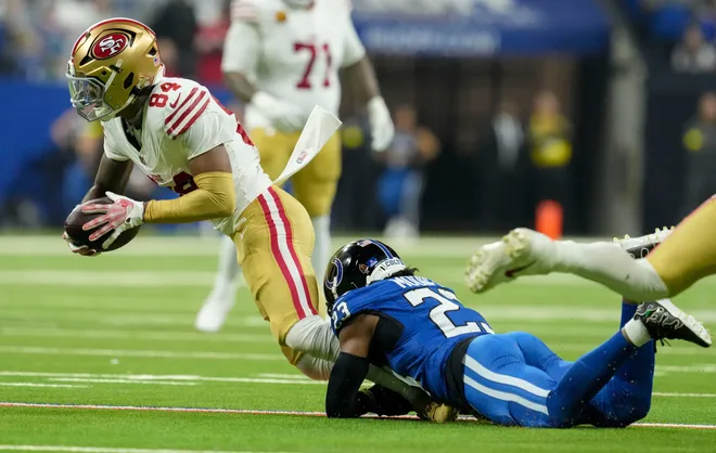 Indianapolis Colts cornerback Kenny Moore II (23) trips up San Francisco 49ers wide receiver Kendrick Bourne (84) on Monday, Dec. 22, 2025, during a game at Lucas Oil Stadium in Indianapolis.