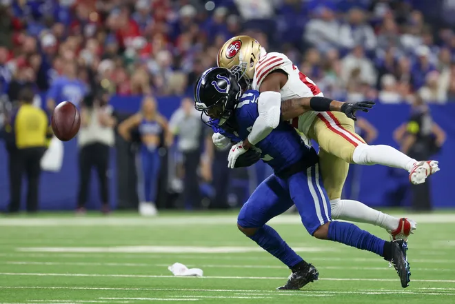 Dec 22, 2025; Indianapolis, Indiana, USA; San Francisco 49ers cornerback Upton Stout (20) breaks up a pass intended for Indianapolis Colts wide receiver Josh Downs (2) in the third quarter of the game at Lucas Oil Stadium. Mandatory Credit: Trevor Ruszkowski-Imagn Images