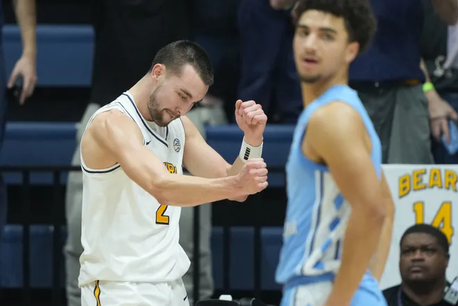 Jan 17, 2026; Berkeley, California, USA; California Golden Bears forward John Camden (left) reacts after scoring while being fouled during the first half against the North Carolina Tar Heels at Haas Pavilion. Mandatory Credit: Darren Yamashita-Imagn Images