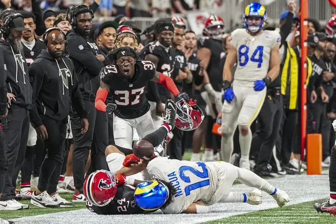 Dec 29, 2025; Atlanta, Georgia, USA; Atlanta Falcons cornerback A.J. Terrell Jr. (24) breaks up a pass against Los Angeles Rams wide receiver Puka Nacua (12) on the final play of the game during the second half at Mercedes-Benz Stadium.