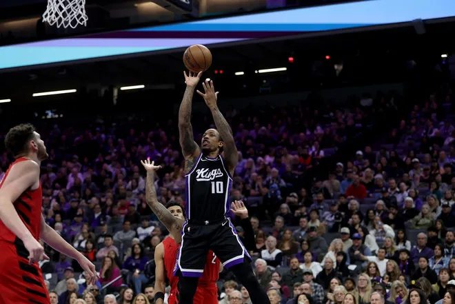 Jan 18, 2026; Sacramento, California, USA; Sacramento Kings forward DeMar DeRozan (10) shoots against the Portland Trail Blazers during the fourth quarter at Golden 1 Center.