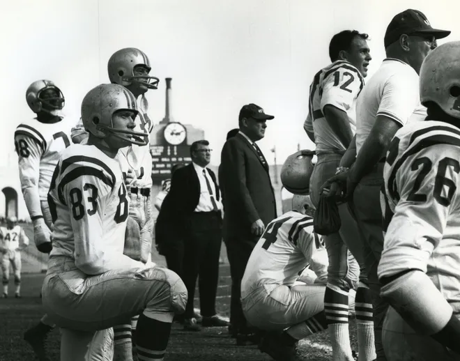 San Francisco 49ers head coach Red Hickey (center) on the sideline with John Brodie (12), Hugh McElhenny (39), Y.A. Tittle (14), and Gorden Kelly (83).