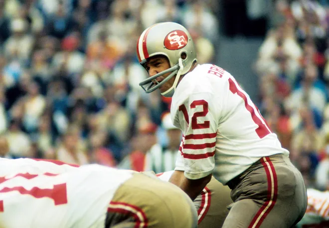 San Francisco 49ers quarterback John Brodie at the line of scrimmage against the St. Louis Cardinals at Busch Stadium.