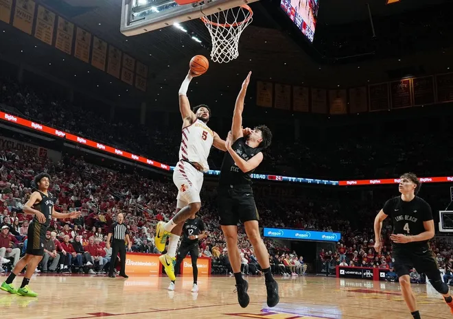 Iowa State Cyclones forward Joshua Jefferson (5) drives to the basket was Long Beach State forward Petar Majstorovic (6) defends during the second half in the NCAA men’s basketball on Dec. 21, 2025, at Hilton Coliseum in Ames, Iowa.