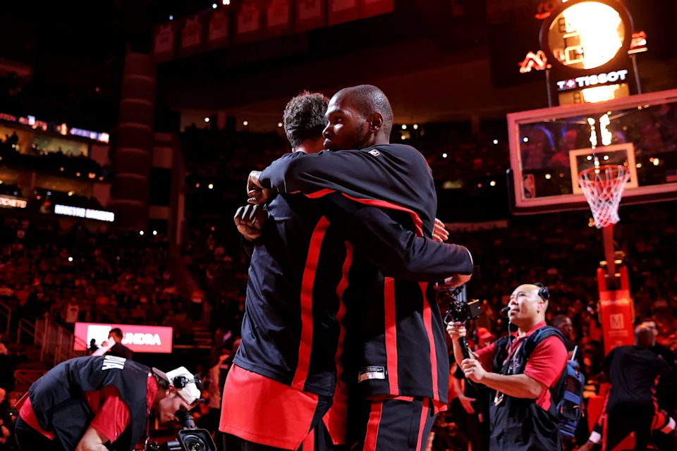 Dec 3, 2025; Houston, Texas, USA; Houston Rockets forward Kevin Durant (7) embraces Houston Rockets center Alperen Sengun (28) during staring lineup introductions prior to the game against the Sacramento Kings at Toyota Center. Mandatory Credit: Erik Williams-Imagn Images