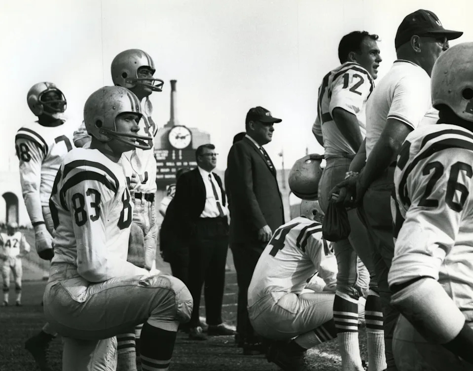 San Francisco 49ers head coach Red Hickey (center) on the sideline with John Brodie (12), Hugh McElhenny (39), Y.A. Tittle (14), and Gorden Kelly (83).