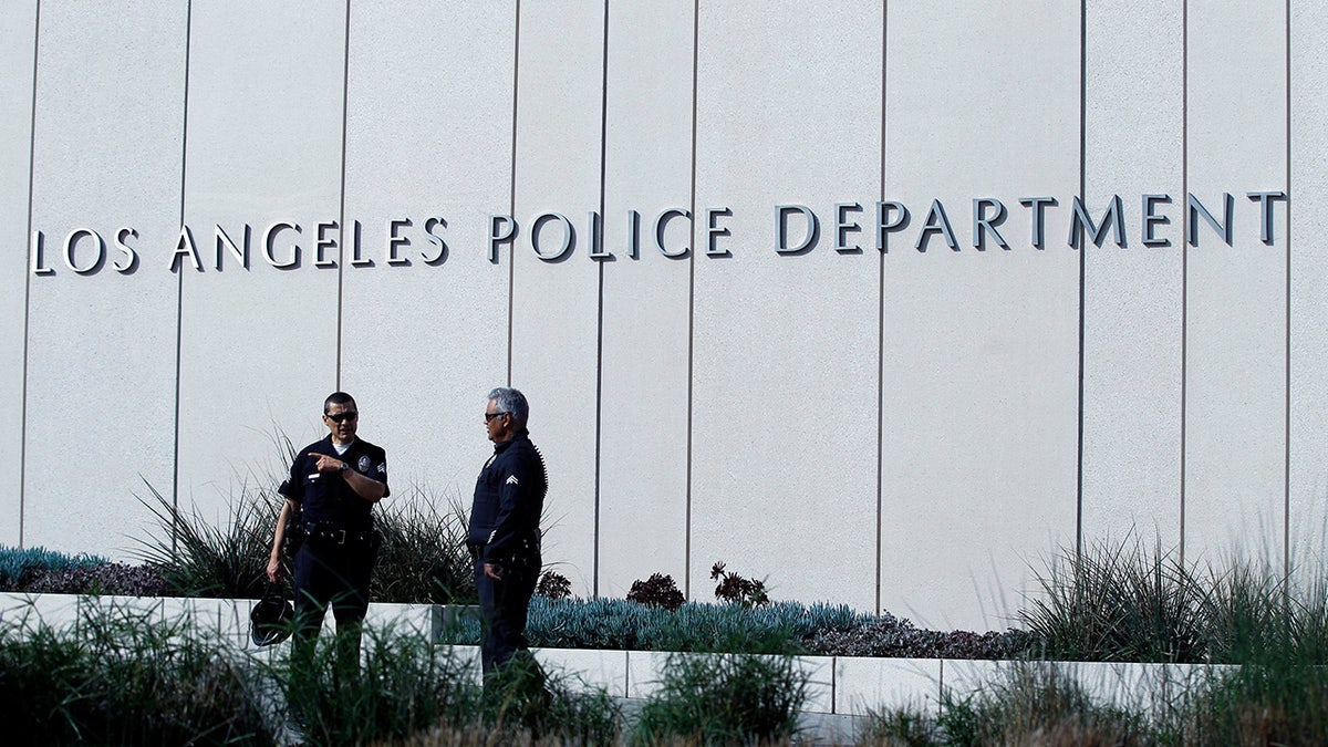 Police officers patrol outside LAPD headquarters in Los Angeles, California