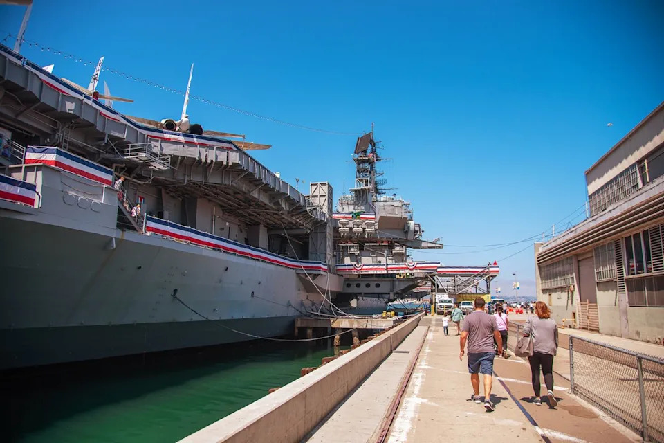 Ana Alarcon/Travel + Leisure Guests walking along the U.S.S. Midway.