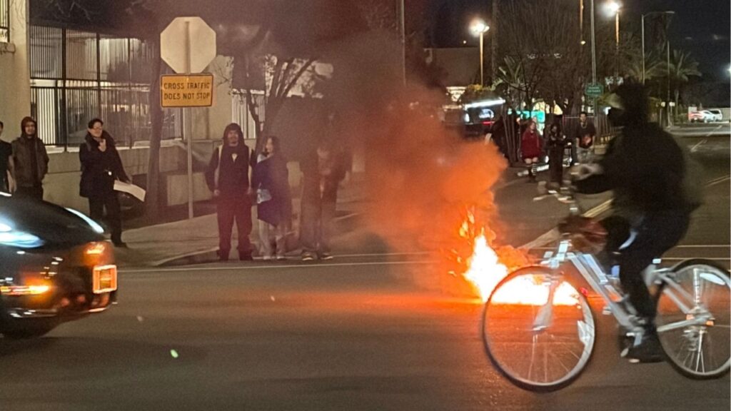 A fire was started at the ICE protest in downtown Fresno on Thursday, Jan. 9, 2026. (GV Wire/Maryanne Casas-Perez)