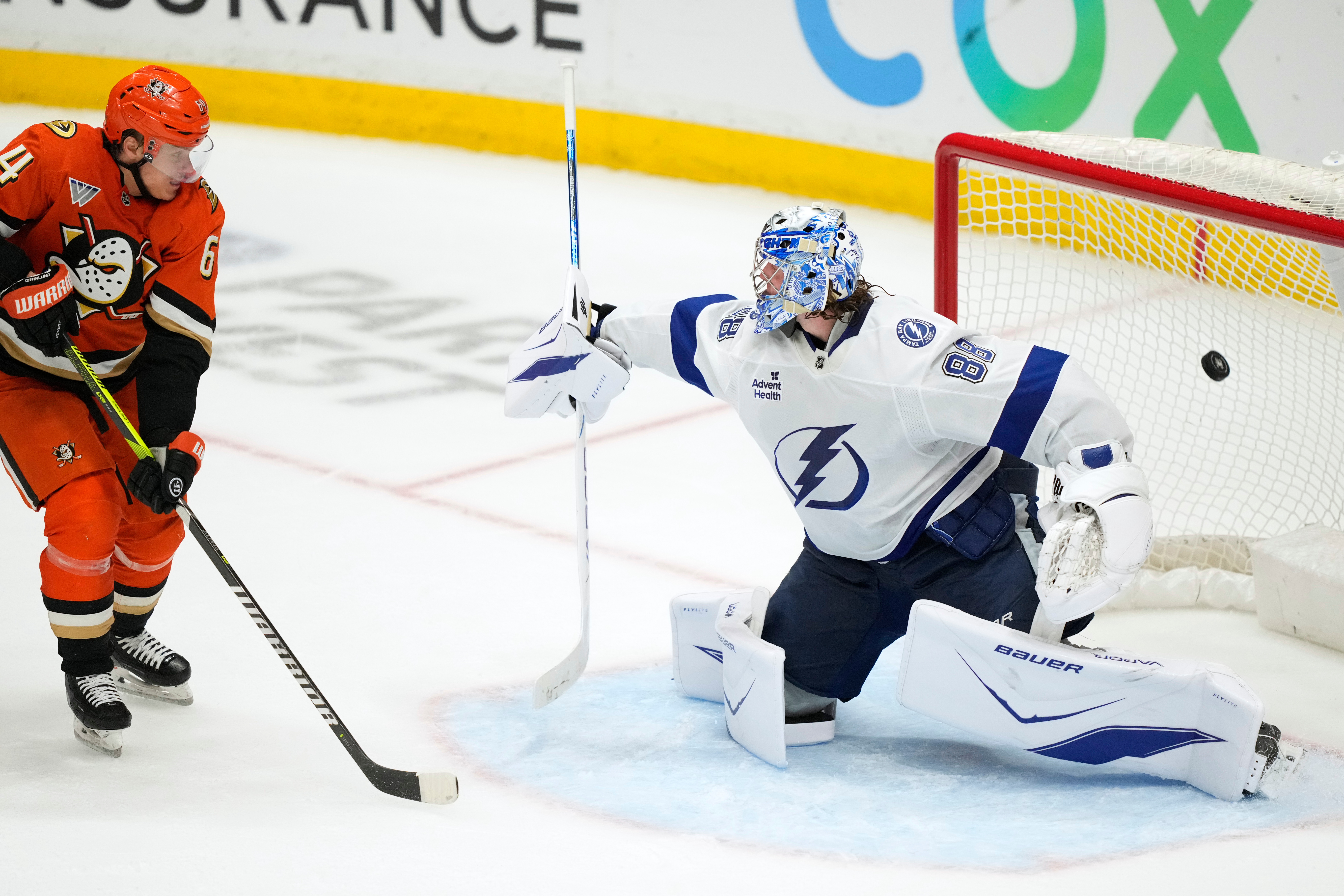Tampa Bay Lightning goaltender Andrei Vasilevskiy, right, is scored on...