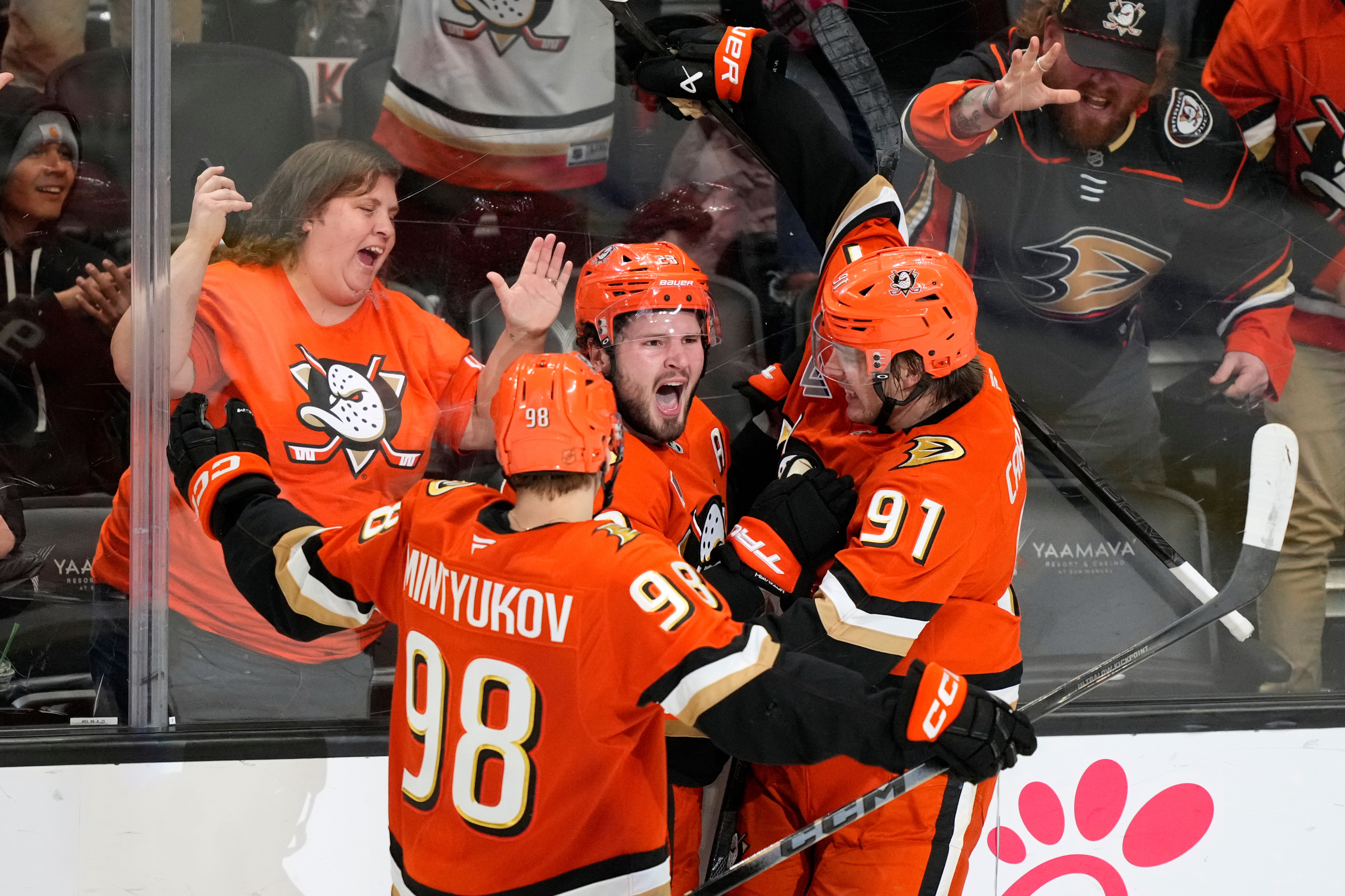 Ducks center Mason McTavish, middle, celebrates his goal with defenseman...