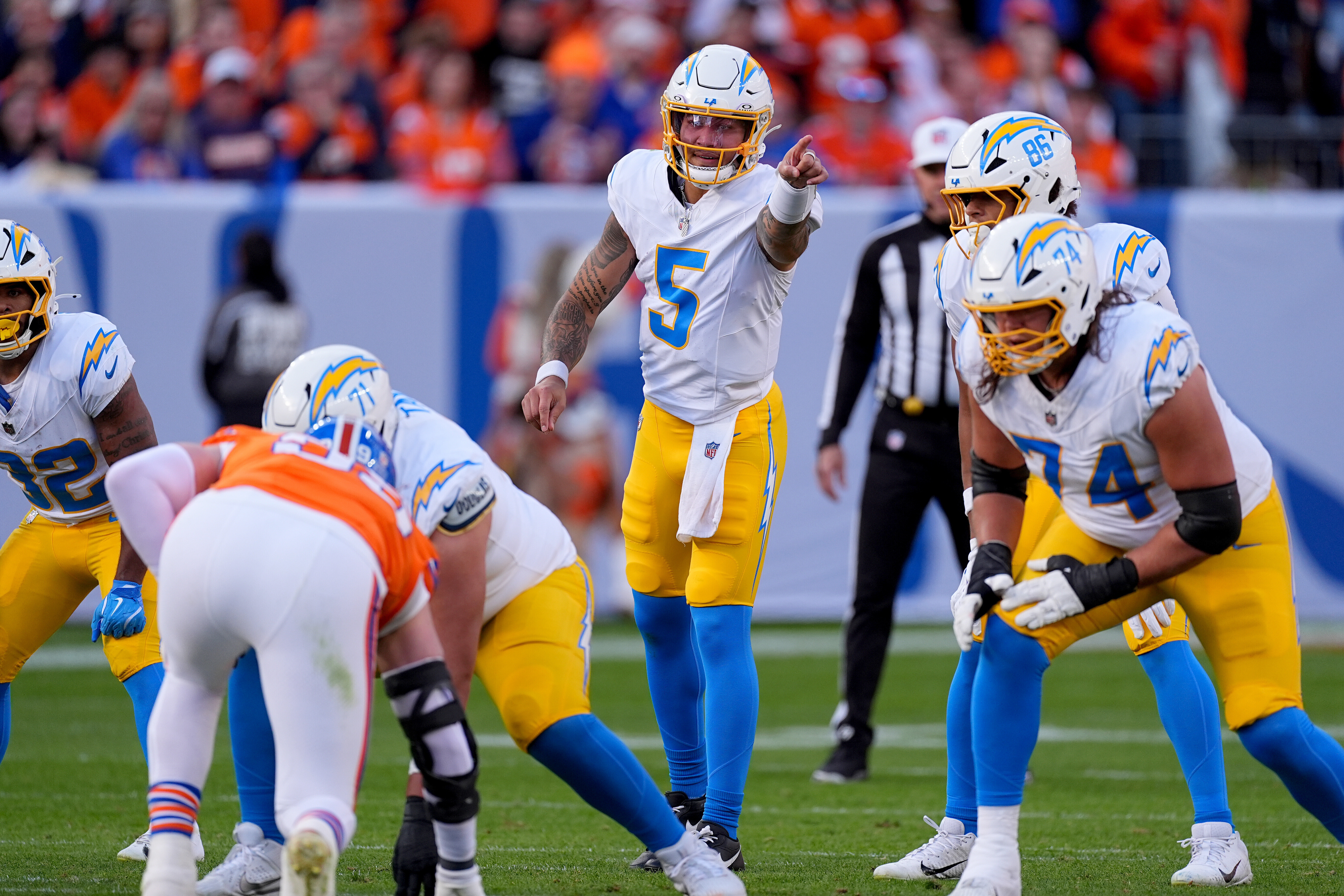 Chargers quarterback Trey Lance (5) calls a play during the...
