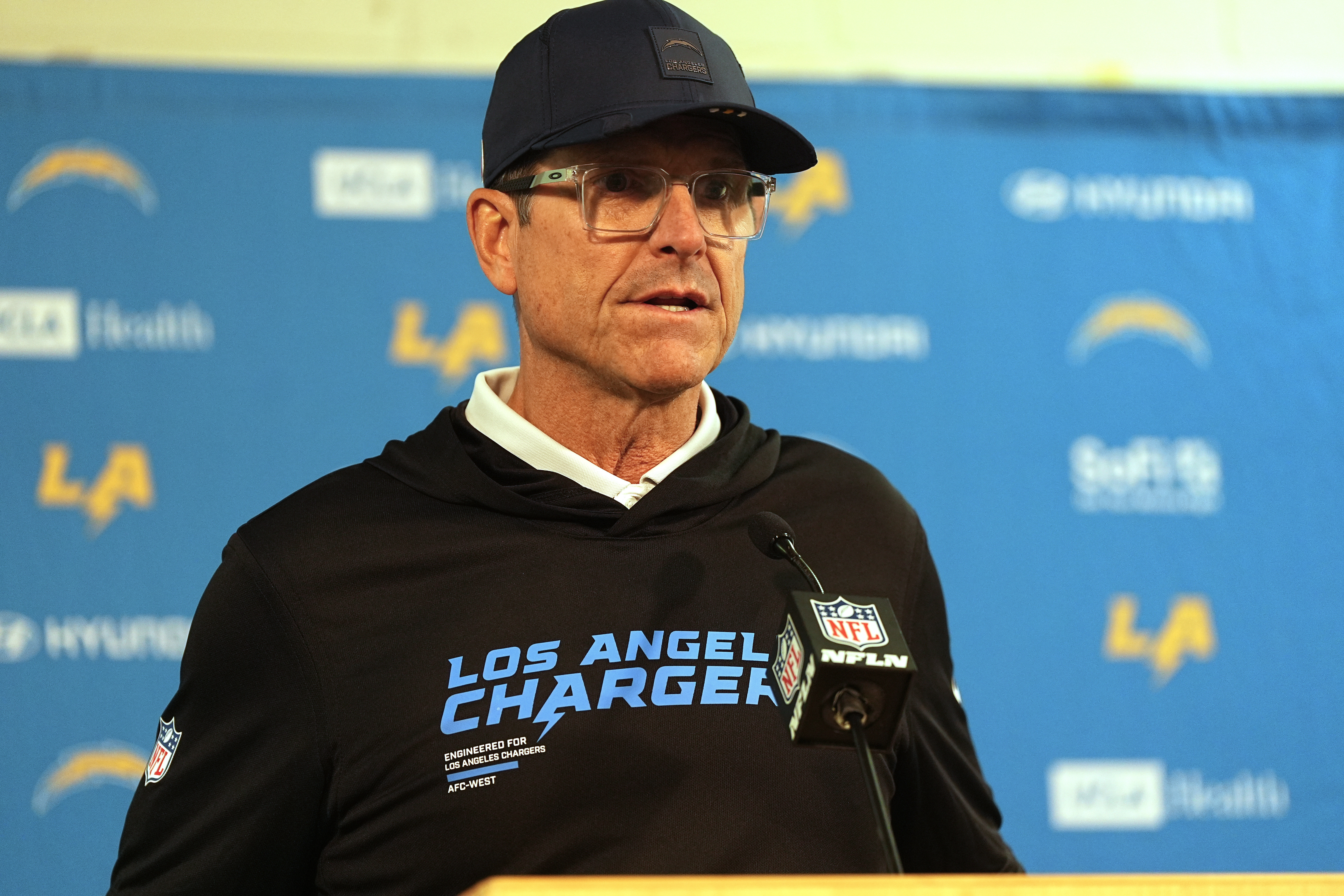 Chargers head coach Jim Harbaugh responds to a question during...