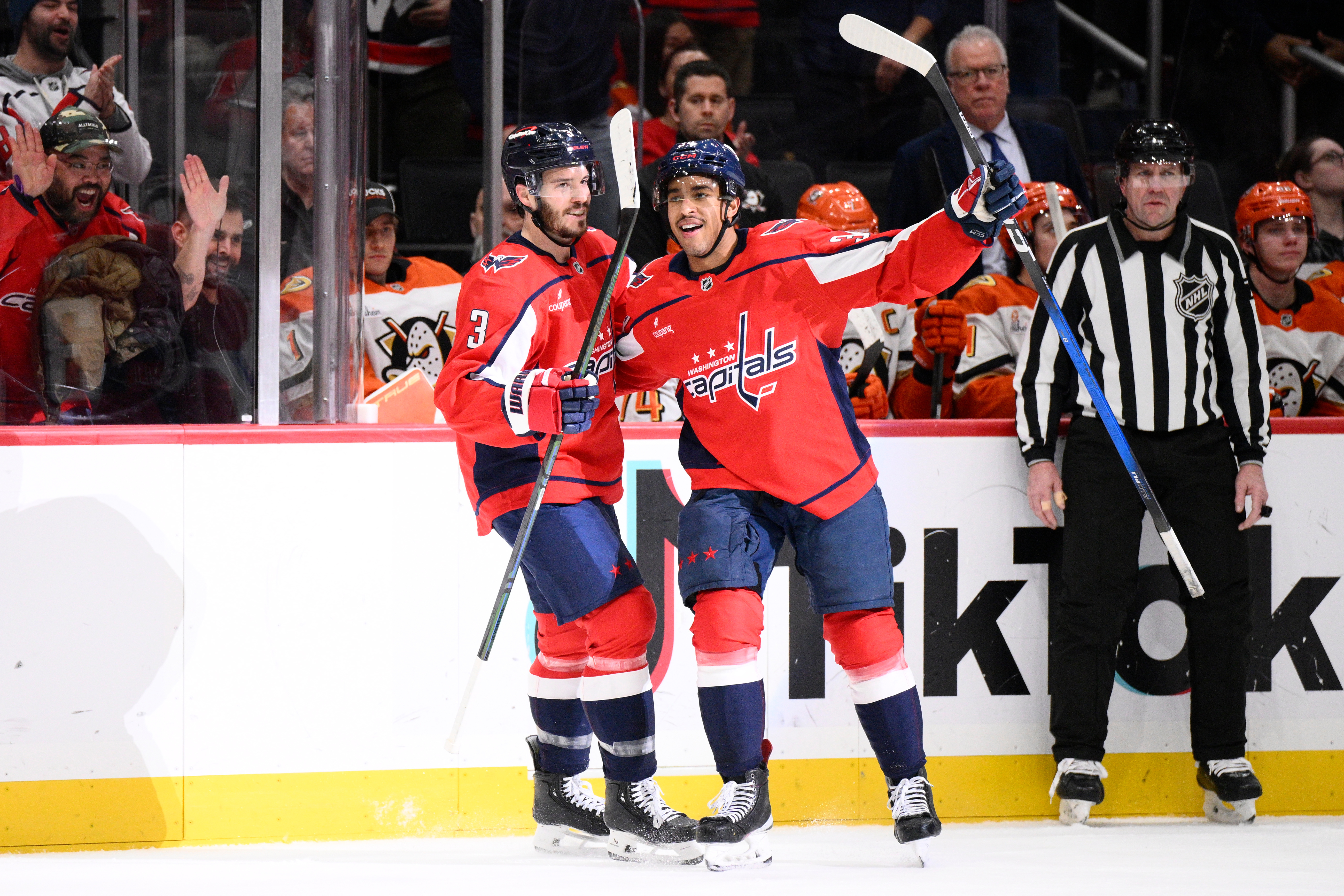 Washington Capitals right wing Justin Sourdif, center, celebrates with defenseman...