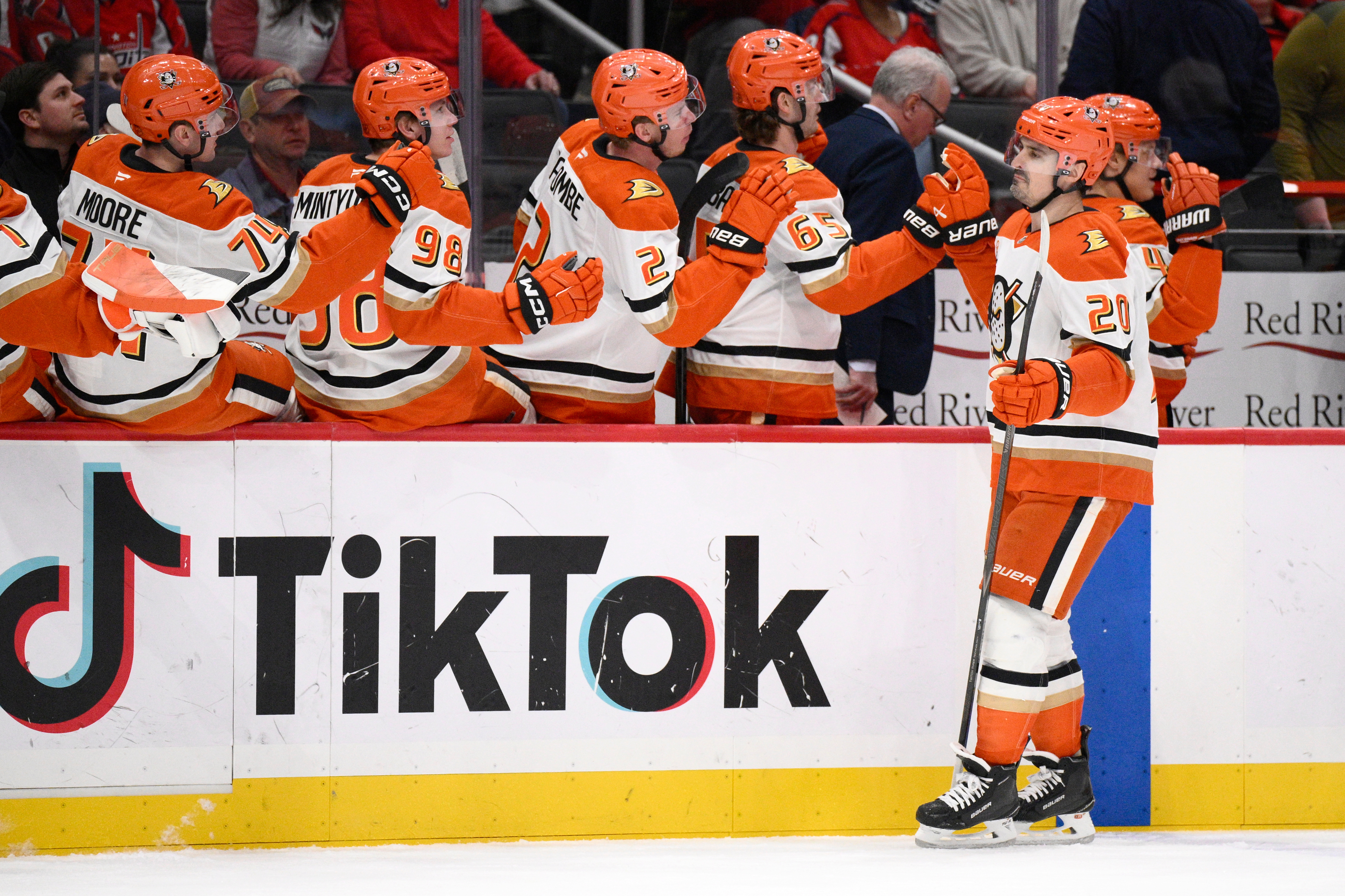 Ducks left wing Chris Kreider (20) celebrates with teammates at...