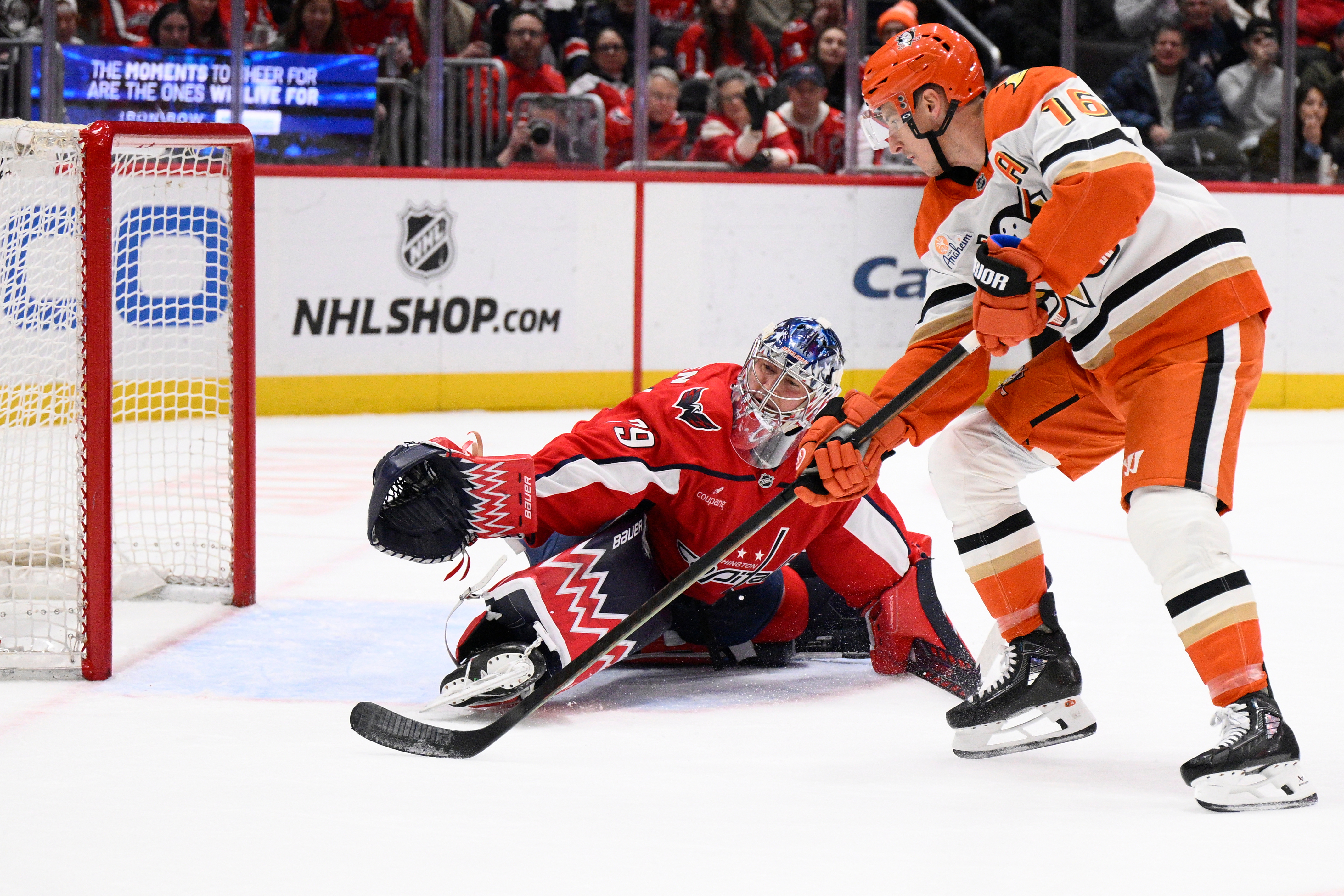 Ducks center Ryan Strome, right, takes a penalty shot against...