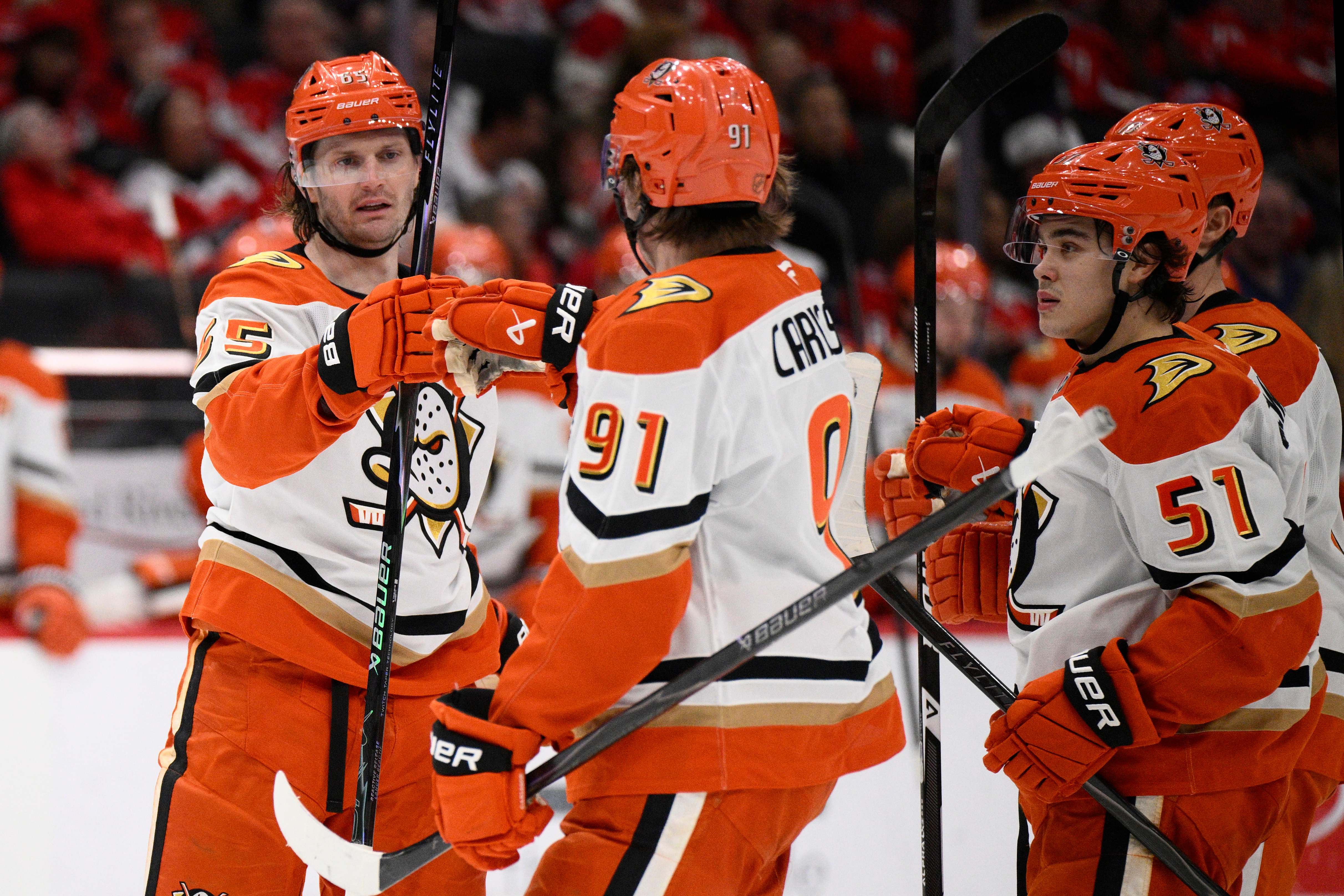 Ducks defenseman Jacob Trouba, left, celebrates after his goal with...
