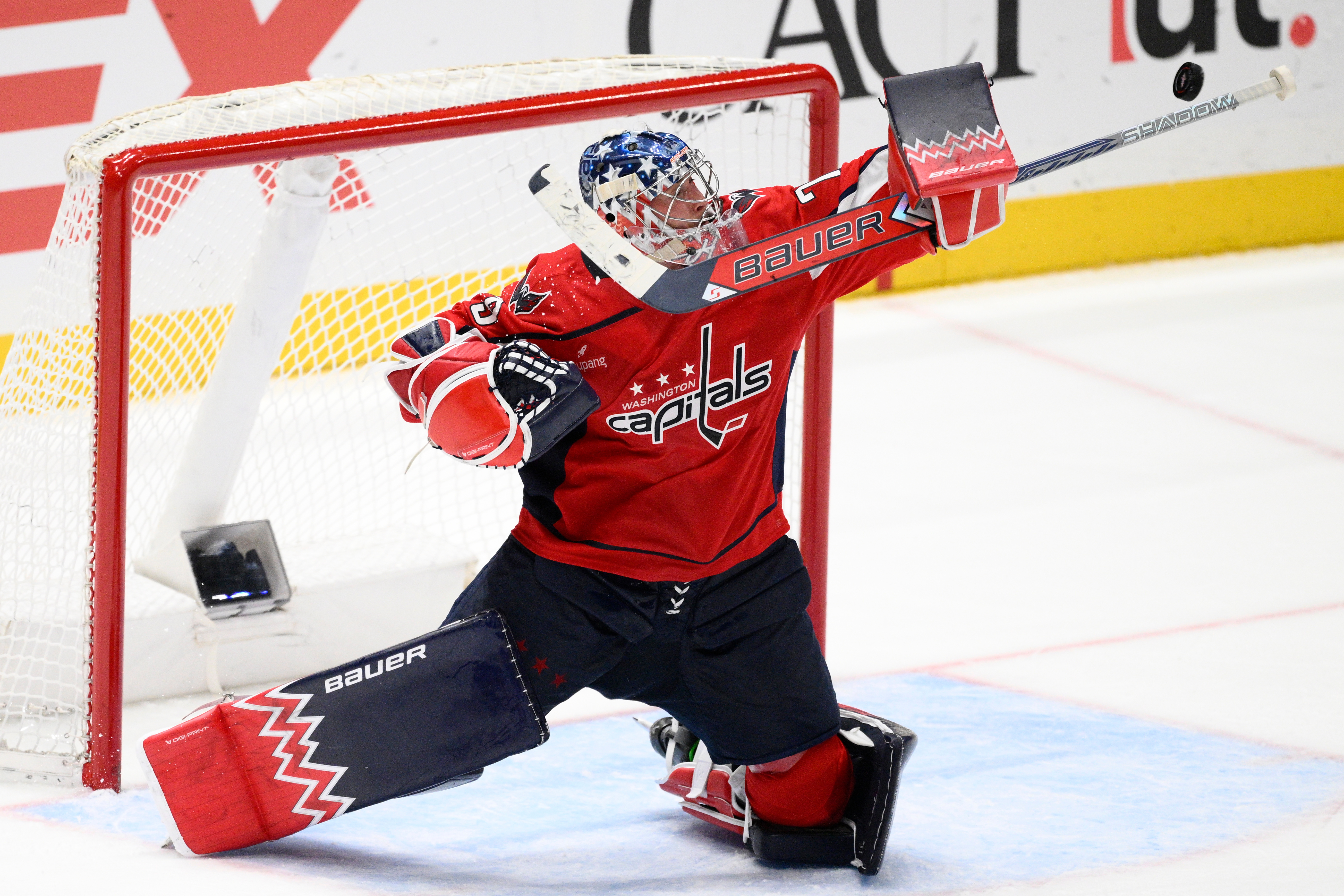 Washington Capitals goaltender Charlie Lindgren deflects the puck during the...
